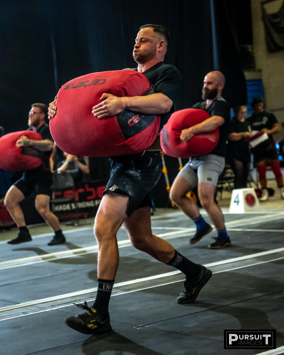 Dan Ball Carring sandbag at Natural strongman Europe
